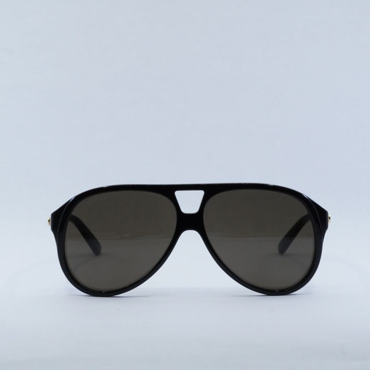 Step out in style with the Gucci GG1286S 001 Black/Brown aviator sunglasses from OSSA FRAMES. These sleek and sophisticated shades are perfect for the fashion-forward man who wants to make a statement wherever he goes.  The black acetate frame of these sunglasses exudes luxury and class, while the brown lenses add a touch of warmth and depth to your look. With a lens socket width of 59 and a bridge size of 12, these sunglasses are designed to fit comfortably and securely on your face. The temple Casual Matte Black Aviator Shield Sunglasses, Matte Black Aviator Shield Sunglasses, Gucci Brown Anti-reflective Sunglasses, Gucci Anti-reflective Brown Sunglasses, Modern Gucci Aviator Sunglasses, Casual Black Gucci Shield Sunglasses, Gucci Black Aviator Sunglasses With Uv Protection, Gucci Brown Tinted Aviator Sunglasses, Gucci Aviator Polarized Sunglasses