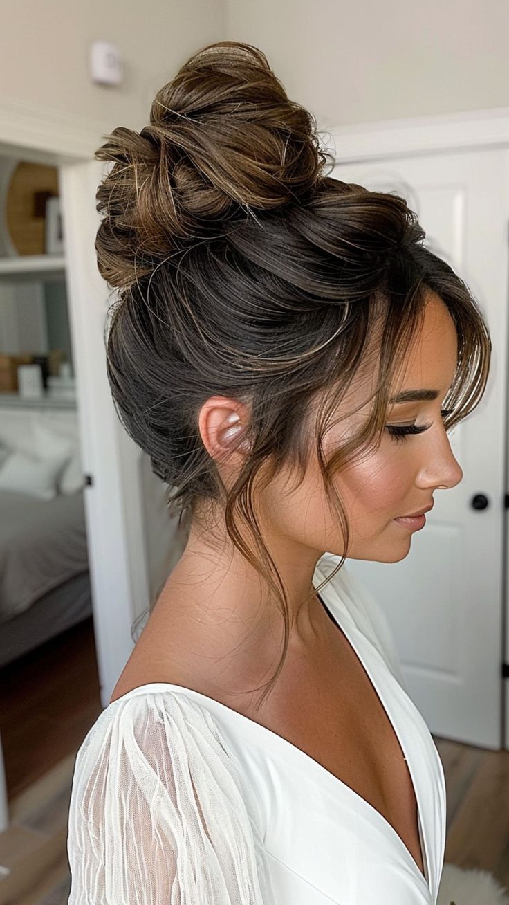 22 Wedding Hairstyle Ideas for Round Faces" Sophisticated Wedding Updo, Top Bun Updo Wedding, Hair In Front Of Face Hairstyles, High Wedding Bun Hairstyles, Pulled Back Wedding Hairstyles, Front Of Bridal Updo, Low Messy Bun Wedding Hair Front View, Updo With Tendrils, Wedding Hair Up High