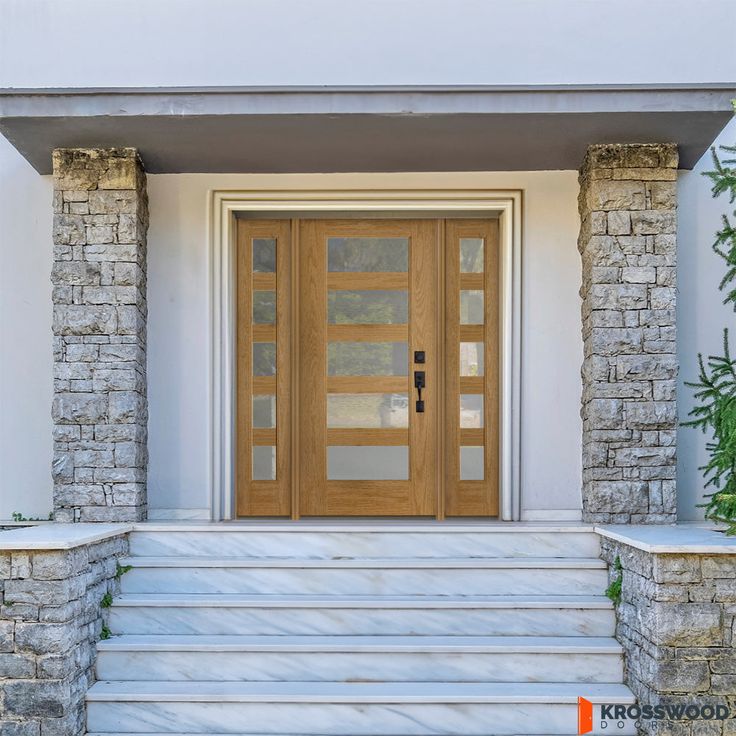 the front door to a house with stone steps