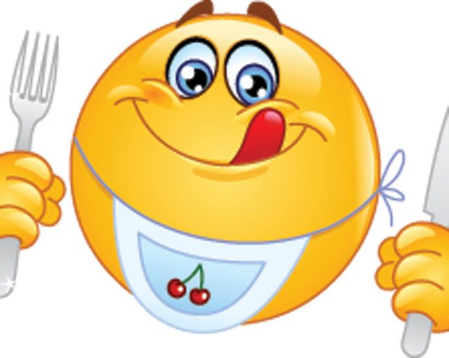 an emoticive yellow smiley face holding a knife and fork with its tongue out