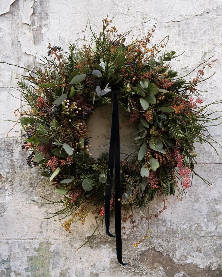 a wreath hanging on the side of a building