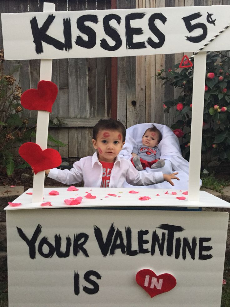 a child in a valentine's day box that says kisses 5 your valentine is in