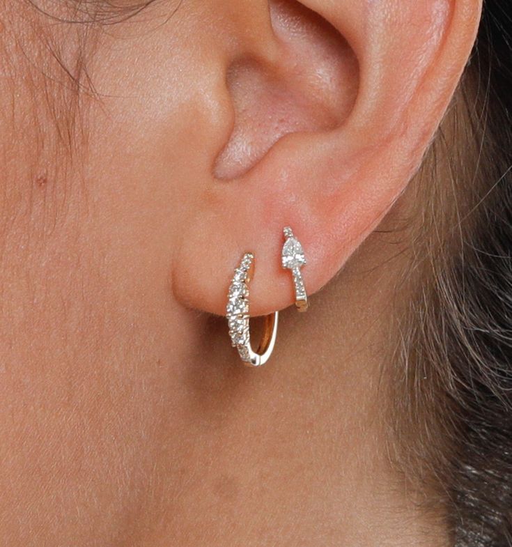 Dazzle them all in these tapered diamond hoop earrings. Centerpiece diamonds are flanked by descending diamonds in smaller sizes for a tapered effect. This delicate but sparkling earring is the perfect party piece or even ideal for your wedding day. Pairs well with our other hoops or huggies for a stacked set too.Size: approximately 15mm Minimalist Diamond Accented Wedding Earrings, Minimalist Diamond Wedding Earrings With Accents, Wedding Hoop Huggie Earrings With Single-cut Diamonds, Modern Single Cut Diamond Earrings For Wedding, Elegant Sparkling Huggie Earrings For Anniversary, Cubic Zirconia Diamond Earrings With Single Cut, Modern Diamond Cut Earrings For Wedding, Minimalist Brilliant Cut Hoop Earrings For Wedding, Huggie Hoop Earrings With Single Cut Diamonds For Wedding