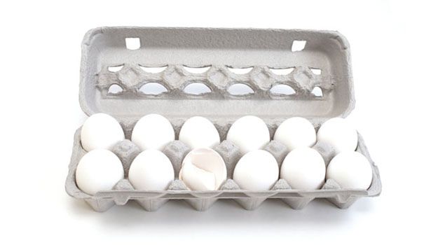 an egg carton filled with white eggs