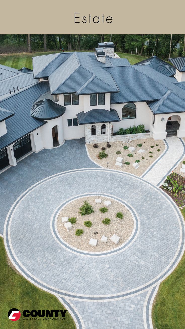 an aerial view of a house with landscaping