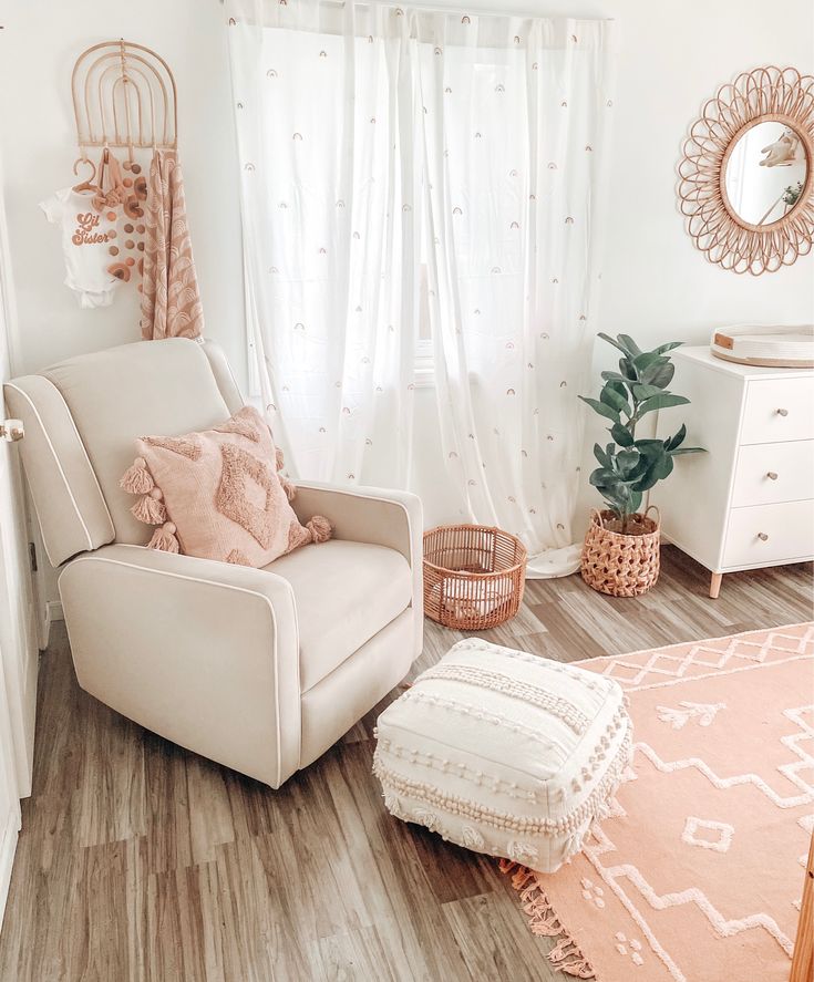 a white chair sitting in front of a window next to a rug and potted plant