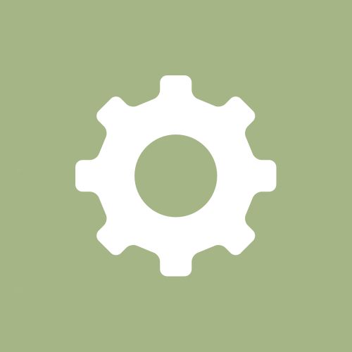 a white gear wheel on a green background