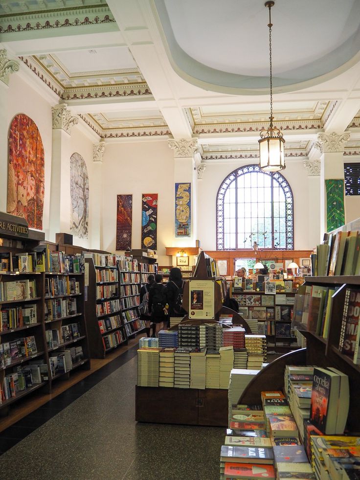 the inside of a library with lots of books