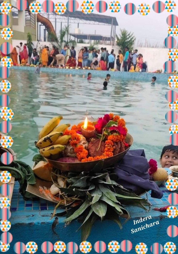 a bowl filled with bananas sitting on top of a blue table next to a pool