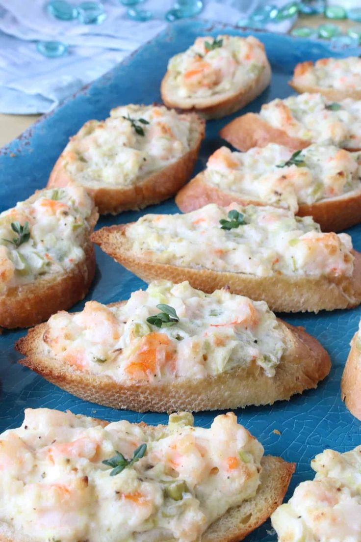 several pieces of bread with crab salad on them