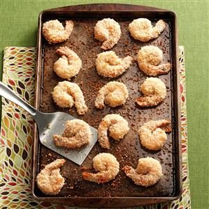 a pan filled with fried shrimp on top of a table