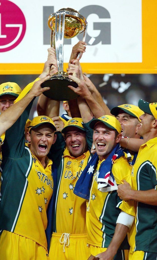 the australian cricket team celebrates with the trophy