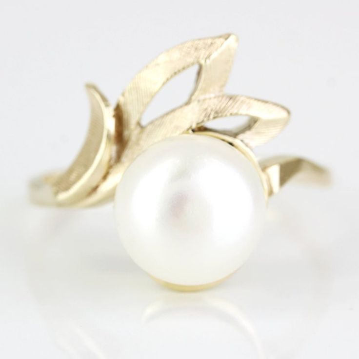 Vintage 14k Yellow Gold Pearl Solitaire Ring This Ring Is Made Of 14 Karat Yellow Gold & Displays A Large Pearl Stone In The Center. The Beautiful Pearl Is Placed On An Arching Design With A Brushed Texture, Adding A Nice Aesthetic To The Piece. "14k" Is Stamped Onto The Ring's Inner Band. This Ring Can Be Resized By Any Qualified Jeweler. Size: 7.75 Metal: 14 Karat Yellow Gold Weight: 2.20dwt / 4.32 Grams 1-Cultured Pearl E-Sxd Modern White 14k Gold Ring, Timeless White Pearl Ring In 14k Gold, Modern 14k Gold Pearl Ring For Wedding, Refined White Jewelry With Prong Setting, Heirloom White Rings For Formal Occasions, 14k Gold Jewelry With Tension Setting, Elegant White Diamond Cut Ring, Formal White 14k Gold Pearl Ring, Timeless White 14k Stamped Rings