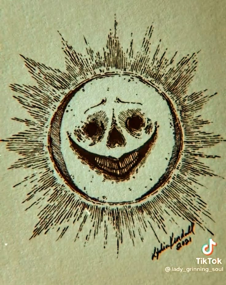 a drawing of a smiling face in the center of a sunburst