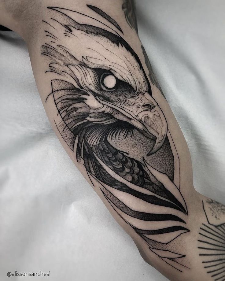 an eagle tattoo on the arm and leg