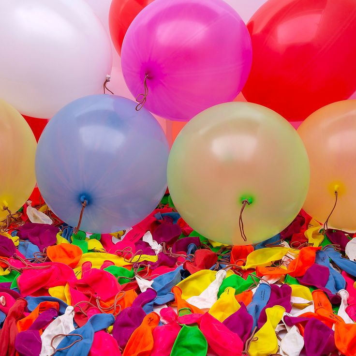 balloons and streamers are scattered on the ground