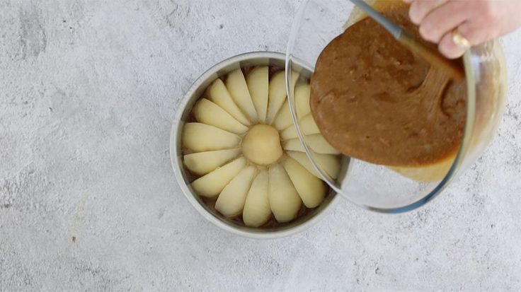 someone is pouring peanut butter into a bowl