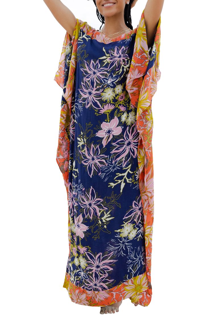 Bright colors and a bold floral pattern distinguish a kaftan that's a comfy and cozy option on warmer days. Boat neck Short sleeves
 100% rayon Hand wash, line dry Imported Model stats: 5'10" height, 32" bust, 25" waist, 36" hip. Casual Floral Print Kaftan For The Beach, Casual Multicolor Boho Print Kaftan, Beach Multicolor Floral Print Kaftan, Multicolor Tropical Print Kaftan For Spring, Multicolor Floral Print Kaftan For Loungewear, Floral Print Patterned Kaftan With Kimono Sleeves, Patterned Kaftan With Floral Print And Kimono Sleeves, Bohemian Floral Print Patterned Kaftan, Spring Tropical Print Multicolor Kaftan