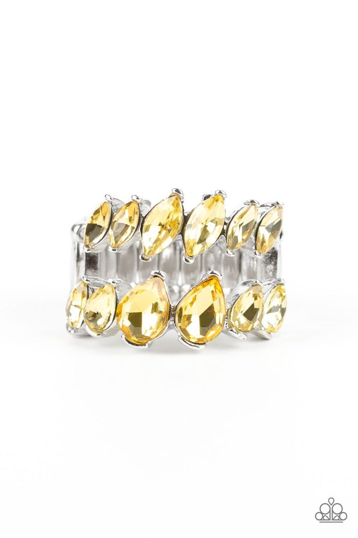 Increasing in size near the center, a row of yellow marquise style rhinestones stacks above a row of yellow teardrop rhinestones for a timelessly stacked look. Features a stretchy band for a flexible fit. Featured inside The Preview at ONE Life! Sold as one individual ring. P4RE-YWXX-051XX Yellow Ring, Freelance Makeup Artist, Pink Jewels, Yellow Rings, Stretch Ring, Rhinestone Ring, Paparazzi Accessories, Inspired Jewelry, Paparazzi Jewelry