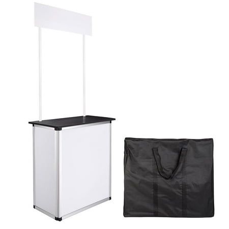 a black and white shopping cart next to a bag on a white background with the same item in front of it