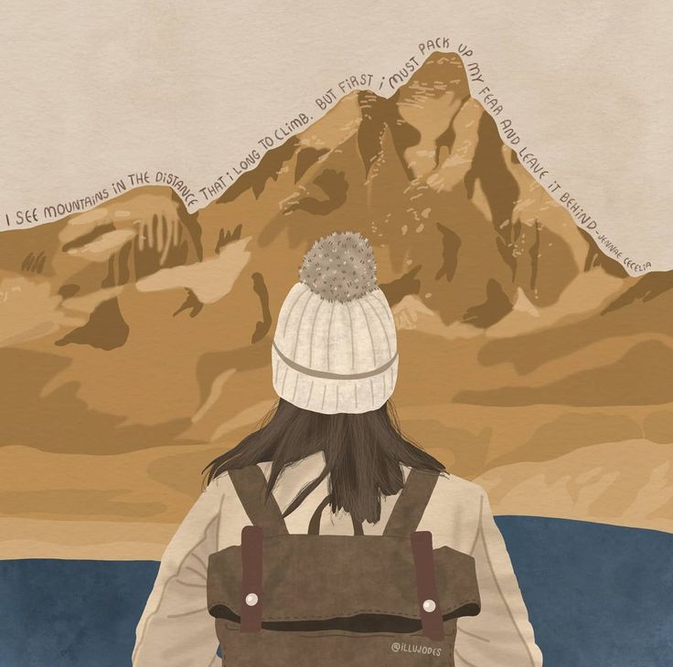 a person with a backpack looking at the mountains