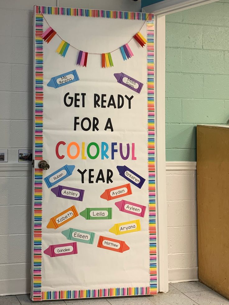 a classroom door decorated with colorful papers and writing that says get ready for a colorful year