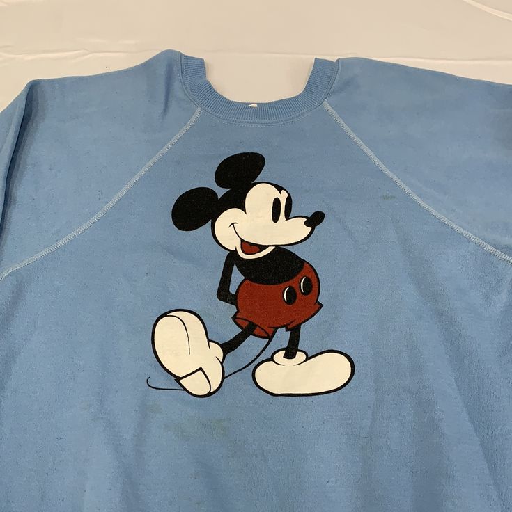 Vintage Mickey Mouse crewneck sweater Size: adult XL chest-22” top to bottom-23” sleeve-28” Condition: Some small stains Cheap Mickey Mouse Crew Neck Top, Disney Sweaters Vintage, Old Mickey Mouse Vintage Shirt, Mickey Vintage Sweater, Mickey Mouse Sweater, Blue Crewneck, Baby Mouse, Vintage Mickey Mouse, Vintage Mickey