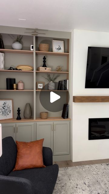 a living room filled with furniture and a flat screen tv mounted on a wall above a fireplace