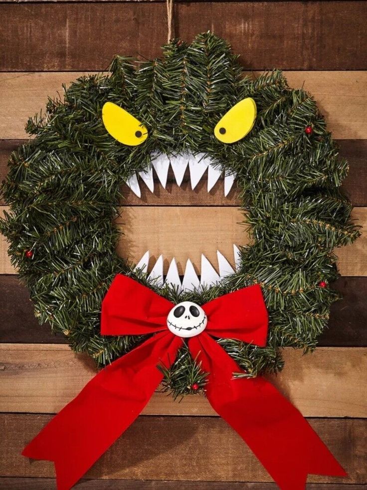 a wreath decorated with fake teeth and a red bow