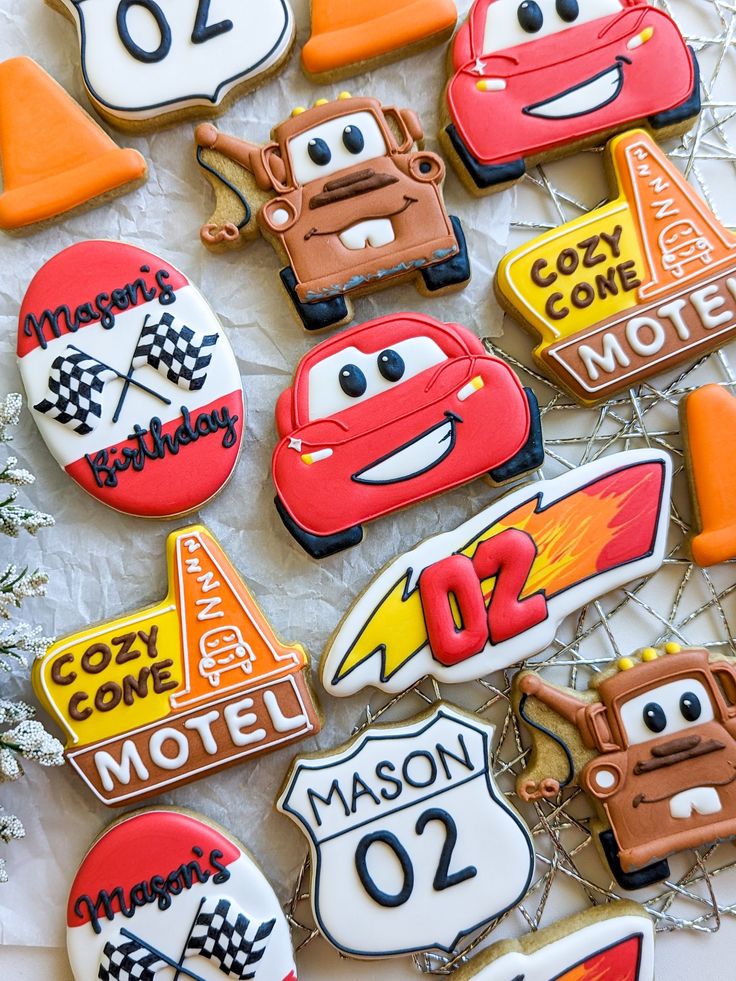 cars and trucks decorated cookies on a table