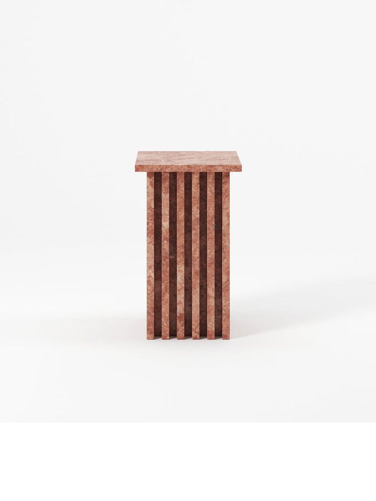 a small wooden table sitting on top of a white floor