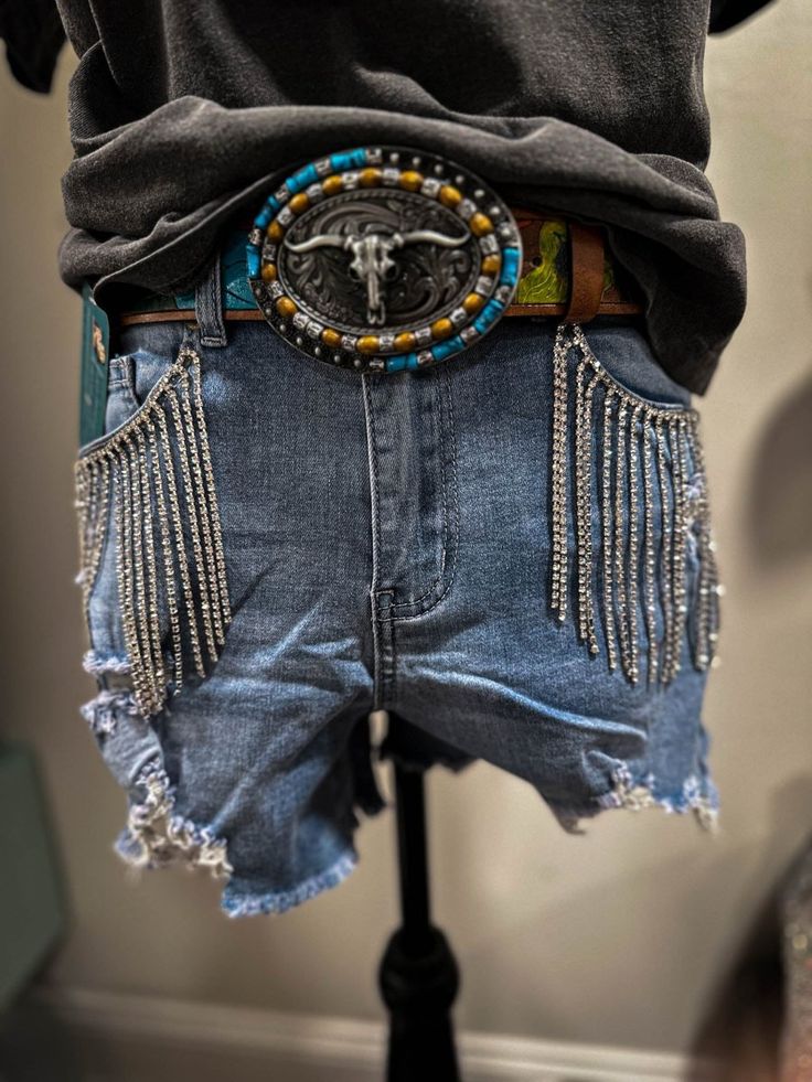 Aldean's Denim Rhinestone Shorts - denim shorts High Waist Bottoms With Frayed Hem For Festival, Festival Shorts With Frayed Hem, Frayed Hem Festival Shorts, Medium Wash Denim Bottoms For Rodeo, Casual Cutoff Bottoms With Rhinestone Fringe, Festival Denim Blue Bottoms, Dark Wash Denim Bottoms For Rodeo, Festival Medium Wash Denim Bottoms, Medium Wash Denim For Festival