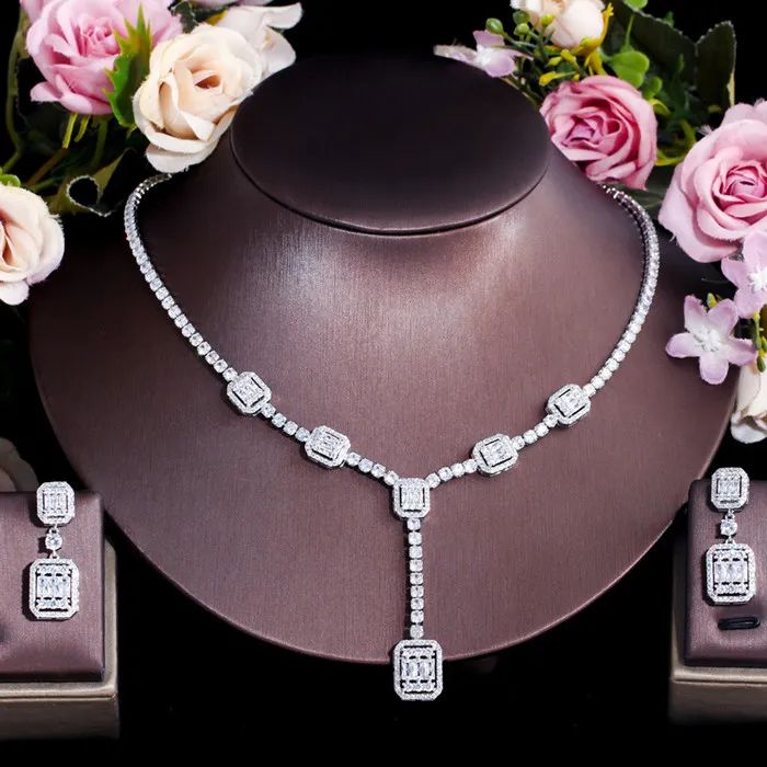 Complete your wedding look with this elegant Bridal Necklace and Earring Jewelry Set. The set is designed to add a touch of sophistication and style to your bridal ensemble, making you shine on your special day.
– This bridal a plus cubic zirconia gemstone necklace set is perfect for adding elegance to any bridal ensemble.– Made with high-quality materials, this set includes a stunning necklace and matching earrings for a complete look.– Perfect for pageant, bridal, bridesmaid, prom, quinceañera Wedding Necklace And Earring Set, Real Diamond Necklace, Wedding Party Accessories, Wedding Look, Prom Jewelry, Fashion Jewelry Sets, Fancy Jewellery, Western Jewelry, Flower Jewelry