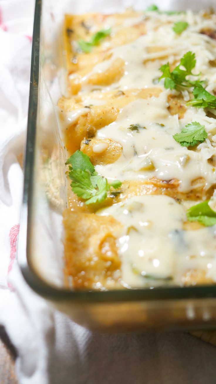 a casserole dish with cheese and herbs