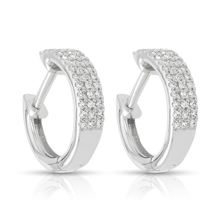 Shiny and bright, these pavé diamond earrings are perfect for daytime or formal wear. Dazzling White Diamond Earrings With Pave Setting, Fine Jewelry Sparkling Diamond Earrings, Dazzling Hoop Earrings With Pave Setting For Formal Events, Classic Diamond White Huggie Earrings With Pave Setting, White Diamond Huggie Earrings With Pave Setting, White Pave Setting Huggie Earrings, Formal Diamond White Hoop Earrings With Pave Setting, Wedding Huggie Earrings With Diamond Pave Setting, Sparkling White Gold Diamond Earrings