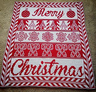 a red and white knitted christmas blanket with merry written on it