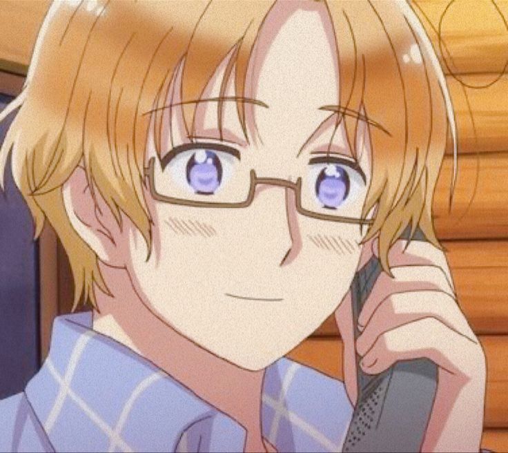 an anime character holding a cell phone to his ear and looking at the camera with blue eyes