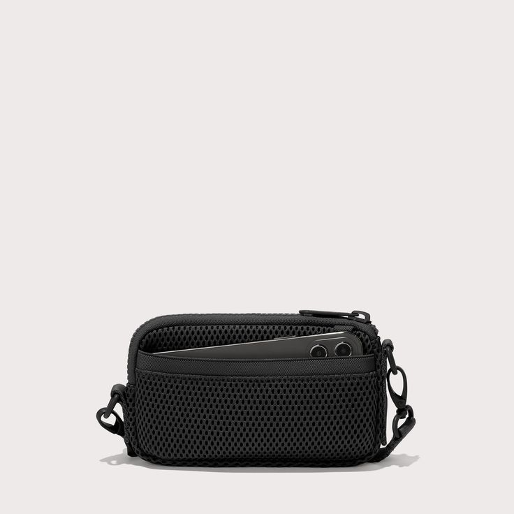 Breathable. Cushiony. Durable. Our lightweight crossbody bag for travel has you covered. Designed for daily adventures and travel too, this black Air Mesh sling bag keeps essentials within reach without weighing you down. Drape it across your chest, on your shoulder, or around your neck for the ultimate way to float through your day. Features interior and exterior pockets, an elastic loop, card slots, and a secure zipper closure, it keeps your stuff safe and organized anywhere. Multifunctional Travel Accessories With Adjustable Strap, Functional Travel Pouch Shoulder Bag, Multifunctional Black Tech Accessories For Everyday Use, Functional Black Tech Accessories For Everyday Use, Functional Chest Bag For Everyday, Black Functional Tech Accessories For Everyday Use, Portable Multifunctional Nylon Travel Accessories, Versatile Black Camera Bag With Removable Pouch, Functional Travel Accessories Shoulder Bag With Removable Pouch