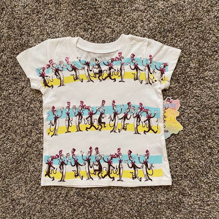 New Dr Seuss “Cat In The Hat” T-Shirt. Size: 2t. Color: White With Yellow / Aqua Stripes. Tagless. 100% Cotton. Multicolor Spring T-shirt For Playwear, Spring Character Print Tops For Playwear, Spring Playwear Tops With Character Print, Yellow Cotton Tops With Character Print, Unisex Fun Tops For Playtime, Unisex Graphic Print Tops For Playtime, Unisex Yellow Graphic Print Top, Spring Playwear T-shirt With Cartoon Print, Unisex Tops For Playtime