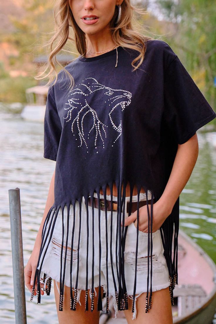 DetailsThe coolest graphic t shirt featuring studded lion and fringe! Content100% Cotton Trendy Black Fringe Top, Trendy Black Top With Fringe, Casual Black Fringe Tops, Trendy Short Sleeve T-shirt With Fringe, Trendy Fringe Short Sleeve T-shirt, Trendy Short Sleeve Fringe T-shirt, Casual Short Sleeve Fringe T-shirt, Casual Crew Neck T-shirt With Fringe, Trendy Black Tops With Rhinestone Fringe