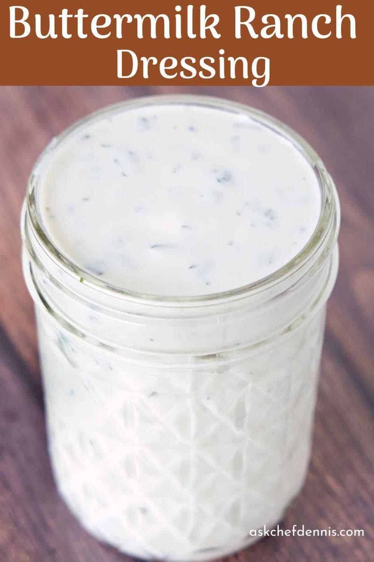 homemade buttermilk ranch dressing in a mason jar on a wooden table with text overlay