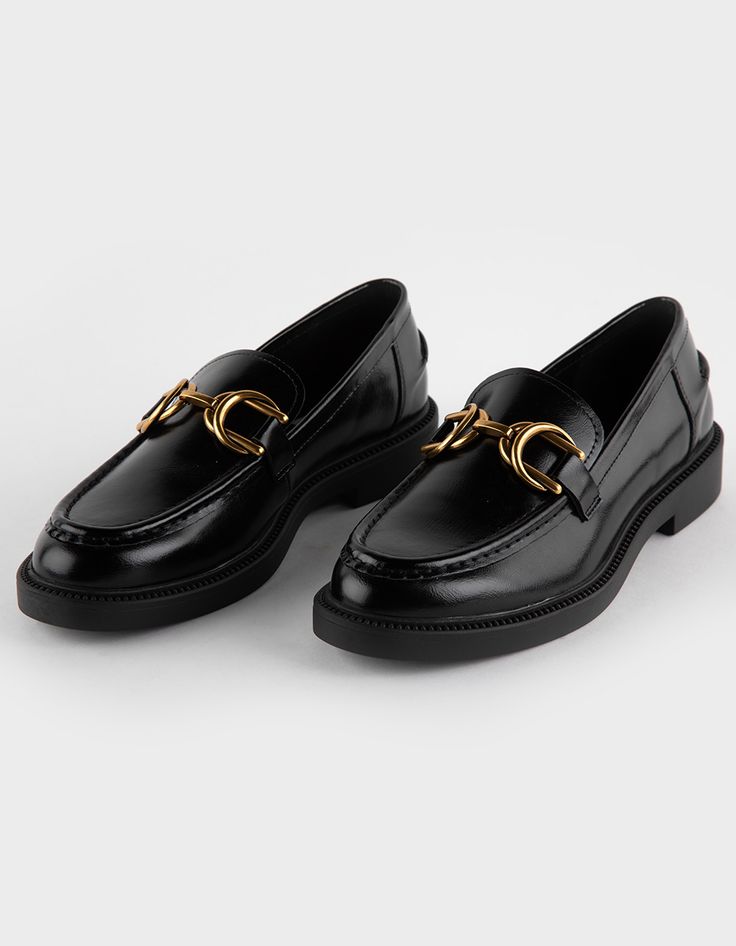 Steve Madden Swamie Loafers. Crafted With High-Quality Faux Leather, These Loafers Offer A Sleek And Polished Look That's Perfect For Any Occasion. Featuring Elegant Gold Buckle Detailing, These Loafers Add A Hint Of Glamour And Refinement To Your Ensemble. The Classic Loafer Silhouette Provides Timeless Appeal, While The Slip-On Design Ensures Easy On-And-Off Wear For Busy Days. Cushioned Footbed. Rubber Outsole. Crafted With All Man Made Materials. Imported. Classic Black Slip-on Loafers, Luxury Designer Black Loafers, Black Luxury Slip-on Platform Loafers, Womens Loafers Black, Luxury Black Slip-on Loafers, Luxury Black Semi-formal Loafers, Lug Sole Boots, Black Loafers, Casual Flats