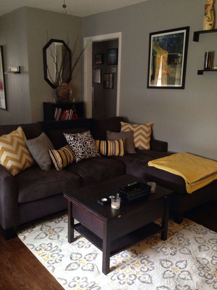 a living room filled with furniture and pillows