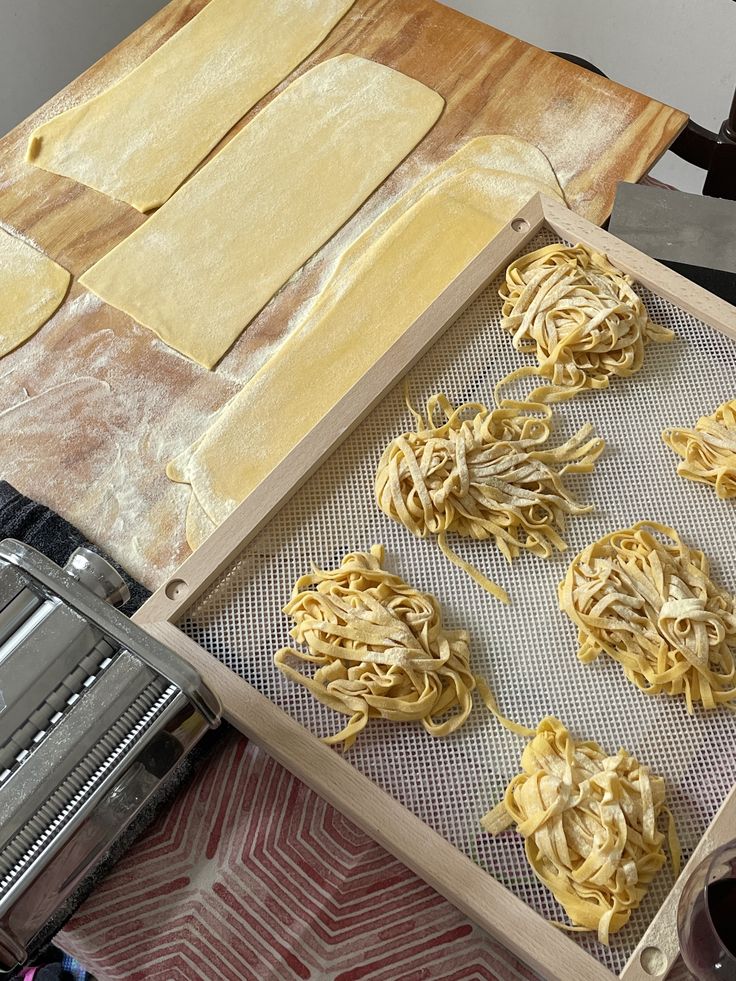 some uncooked food is being prepared on a tray and ready to go into the oven