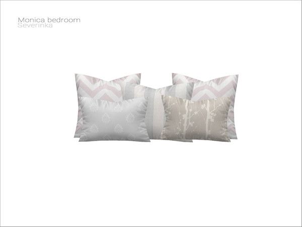 three pillows with white and grey designs on them