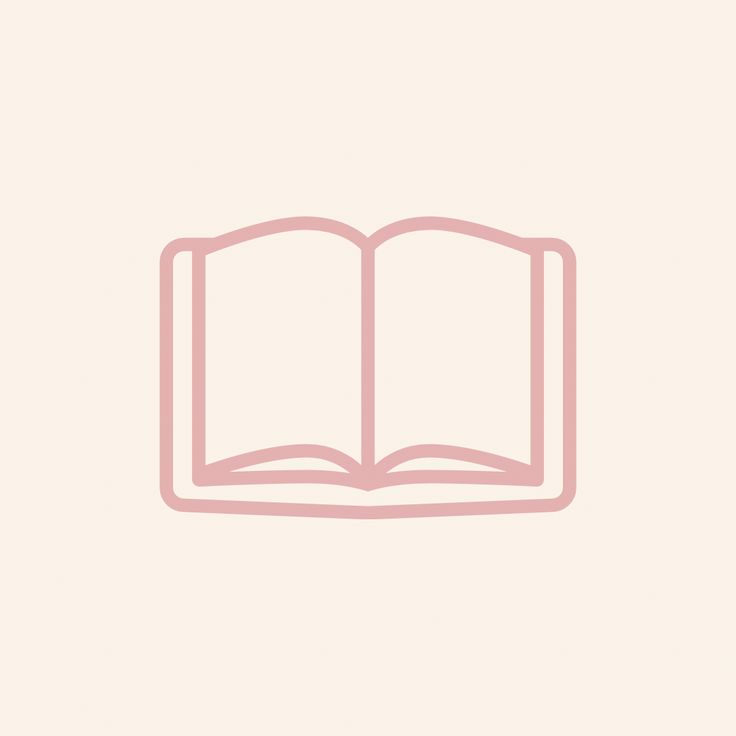 an open book sitting on top of a white table next to a pink wallpaper