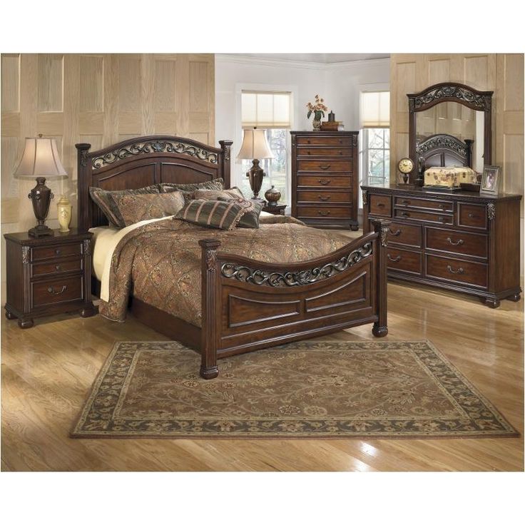 a bedroom scene with focus on the bed and dresser