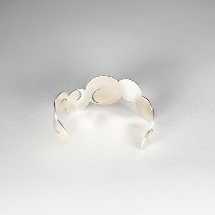 Product Description : Why is it so EXPENSIVE? Product Story General Product Information This silver bangle was created with expert skill by craftsmen at a metalwork carving studio with a history of more than 200 years. Jardin means garden in French, and the design was inspired by the traditional Japanese garden style of karesansui, or dry landscape garden. Karesansui is a garden style that expresses magnificent natural scenery of mountains and seas by using stones, sand, plants, and trees withou Modern Hand Forged Bangle Jewelry, Elegant Hand Forged Bangle Bracelet, Modern Hand Forged Bangle, Hand Forged Bangle For Formal Occasions, Formal Hand Forged Bangle Jewelry, Formal Hand-forged Bangle Jewelry, Hand Forged Elegant Bangle, Modern Hand Forged Bangle Bracelet, Artisan Sterling Silver Round Bracelet