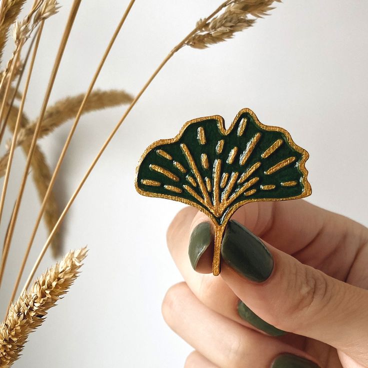 GINKGO BILOBA handmade wooden broochpin. The brooch is made according to my author's sketch and painted by me (acrylic). C O L O R greenantique gold. F A S T E N I N G pin.S I Z E 3x3cm (1,5"x1,5") For more printable art, visit my home page:https:www.inspireuplift.comshopMySiberianPrintsOr my instagram page:https:www.instagram.comstrange.art.studentPlease contact me if you have any questions!Thank you for visiting! Unique Handmade Green Brooches, Unique Green Enamel Pin, Unique Green Enamel Pin Gift, Green Enamel Brooch Pin As Gift, Artistic Green Brooches For Gifts, Green Brooch Enamel Pin For Gift, Artistic Green Brooch For Gift, Green Enamel Pin Brooch For Gift, Unique Handmade Gold Enamel Pin