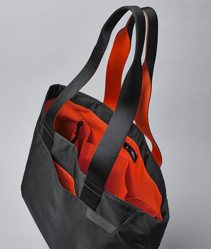 A must-have accessory for carrying all of your essentials. Whether you're running errands or enjoying some time by the sea, the Elements Tote is perfect for any occasion. Its foldable design makes storage a cinch and lets you bring it along wherever life takes you. Made with durable and high-quality materials, this tote can withstand daily wear and tear. Its simple yet stylish look will fit in anywhere, making it a great choice for everyone. Comfortable & sturdy strap handles Magnetic closure Qu Functional Everyday Packable Travel Accessories, Functional Packable Travel Accessories, Packable Functional Travel Accessories For Everyday, Functional Nylon Travel Accessories For Daily Use, Functional Nylon Travel Accessories, Functional Foldable Bags For Outdoor Activities, Functional Foldable Bags For Everyday Use, Everyday Foldable Functional Bag, Functional Foldable Bag For Daily Use